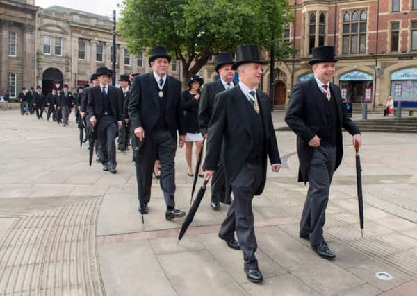 New Master Cutler Richard Edwards, left, and immediate past Master Craig McKay, lead the procession to Sheffield Cathedral