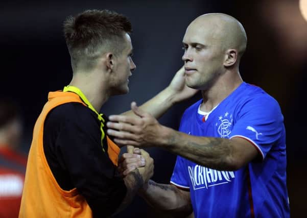 Sheffield Wednesday v Glasgow Rangers......Owls ex Ranger Rhys McCabe at the final whistle with Nicky Law
