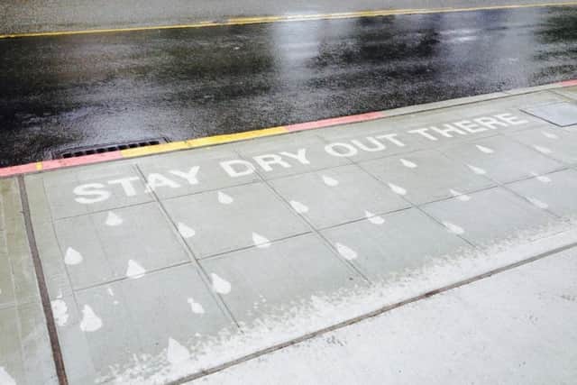 Stay Dry Out There - Rainworks words come to life on city streets but only when it's wet.