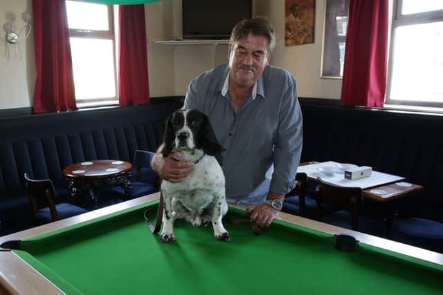 Sonny the Springer with owner Paddy Moloney, after he'd got his head caught in the pool table at the White Hart pub