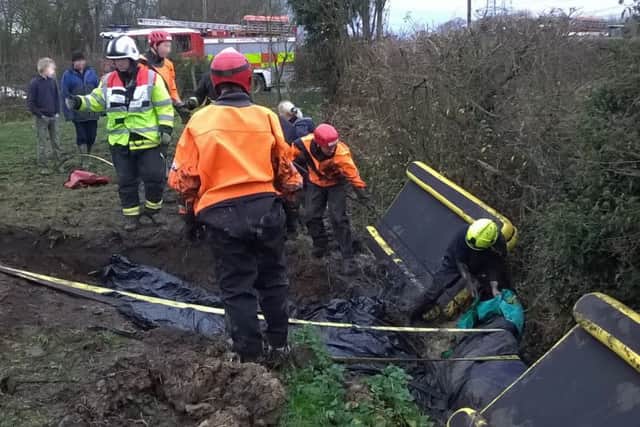 A retired racehorse had to be freed by firefighters after getting stuck in the mud. See Ross Parry copy RPYHORSE : Thoroughbred Herbie was hauled on to dry land this morning (Tues) after getting trapped in a drainage ditch in Sykehouse, South Yorks., overnight.  The 30-year-old horse was exhausted following the ordeal and earned himself a well-earned rest on a pile of hay, with owner Julie Hepworth by his side.  Julie bought him many years ago, after his successful career as a former racehorse who ran at Ascot and Epsom, came to an end due to an injury.  A South Yorkshire Fire and Rescue spokeswoman confirmed they were called to reports of a horse that had fallen into a ditch.  She added: "Firefighters, with help from other people there, were able to dig a section of the ditch out and then put straps around the horse and drag it out from the ditch."