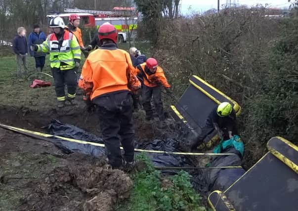 A retired racehorse had to be freed by firefighters after getting stuck in the mud. See Ross Parry copy RPYHORSE : Thoroughbred Herbie was hauled on to dry land this morning (Tues) after getting trapped in a drainage ditch in Sykehouse, South Yorks., overnight.  The 30-year-old horse was exhausted following the ordeal and earned himself a well-earned rest on a pile of hay, with owner Julie Hepworth by his side.  Julie bought him many years ago, after his successful career as a former racehorse who ran at Ascot and Epsom, came to an end due to an injury.  A South Yorkshire Fire and Rescue spokeswoman confirmed they were called to reports of a horse that had fallen into a ditch.  She added: "Firefighters, with help from other people there, were able to dig a section of the ditch out and then put straps around the horse and drag it out from the ditch."