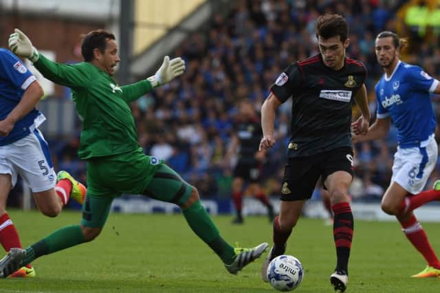 John Marquis rounds the goalkeeper to score