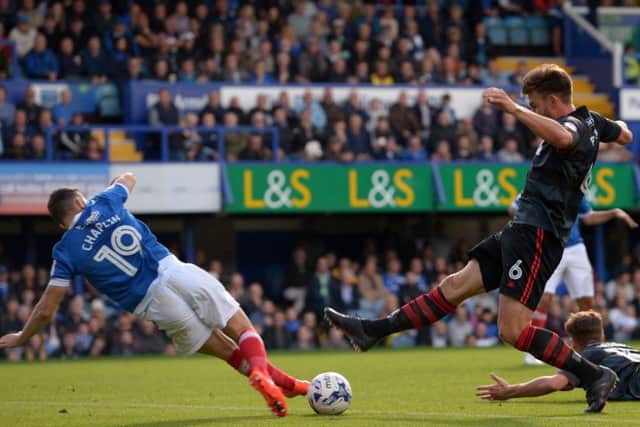 Andy Butler goes for the loose ball with Connor Chaplin