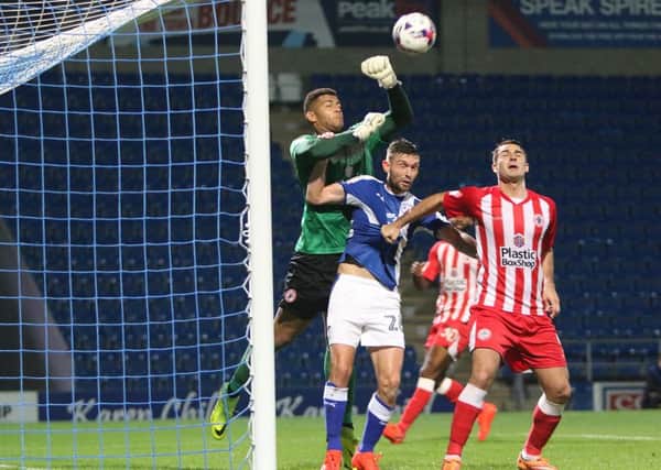 Chesterfield FC v Accrington Stanley, visiting keeper Aaron Chapman punches the ball off his line