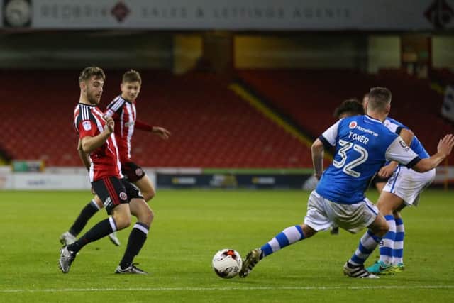 Ben Whiteman of Sheffield Utd  threads a pass past Kevin Toner of Walsall during the Checkatrade Trophy match at Bramall Lane Stadium, Sheffield. Picture date: October 4th, 2016. Pic Simon Bellis/Sportimage