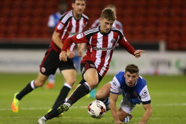 David Brooks of Sheffield Utd leaves Joe Edwards of Walsall during the Checkatrade Trophy match at Bramall Lane Stadium, Sheffield. Picture date: October 4th, 2016. Pic Simon Bellis/Sportimage