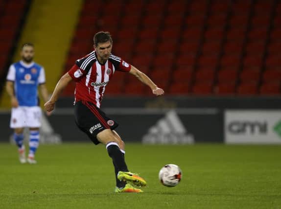 Chris Basham of Sheffield Utd has a shot on goal during the Checkatrade Trophy match at Bramall Lane Stadium, Sheffield. Picture date: October 4th, 2016. Pic Simon Bellis/Sportimage