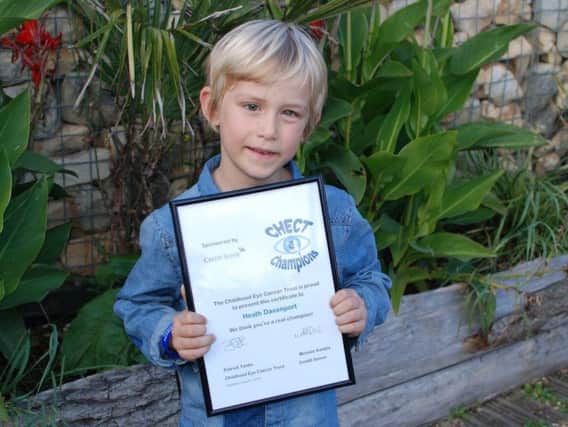 Heath Davenport, aged six, with his special bravery award