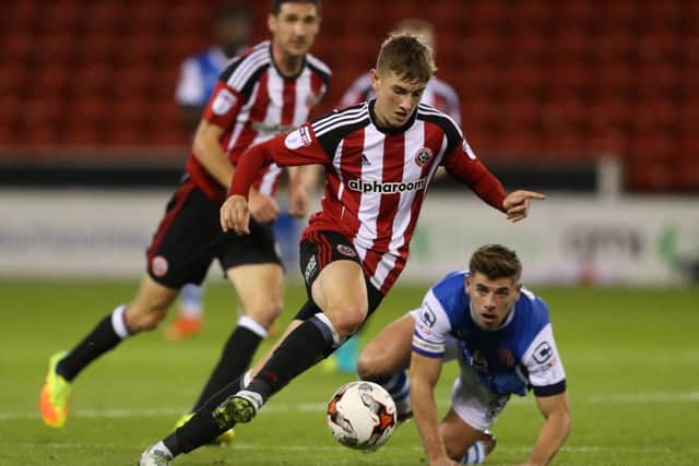 David Brooks of Sheffield Utd leaves Joe Edwards of Walsall trailing during the Checkatrade Trophy match at Bramall Lane. Pic Simon Bellis/Sportimage