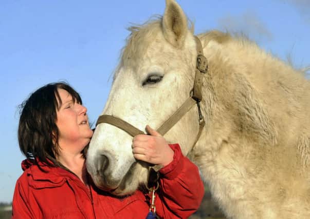 Pictured is Mary Hepworth with Fergus the pony at Alberts Horse and Pony Sanctuary,South Lane,Cawthorne