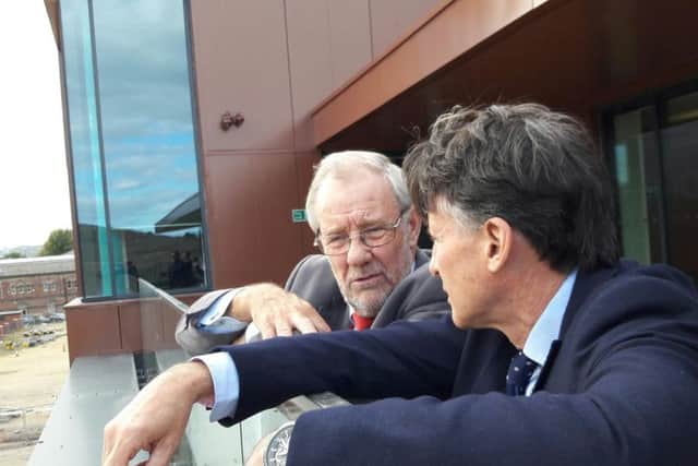 Lord Coe grabs some fresh air on the balcony of the new UTC Sheffield