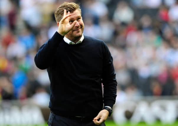 MK Dons boss Karl Robinson wants to wave goodbye to the Checkatrade Trophy
