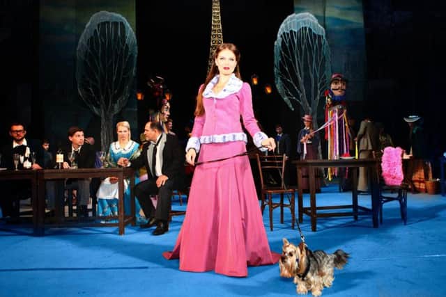 Musetta on stage with a dog in La Boheme