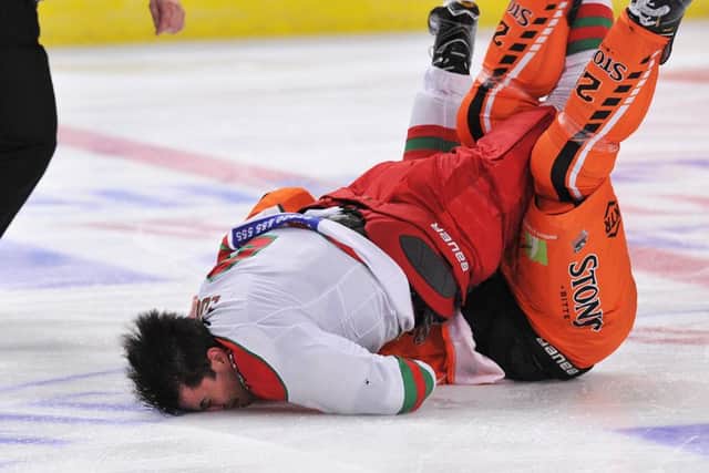 Crunch: Mark Louis hits the ice, head-first. Pic: Dean Woolley