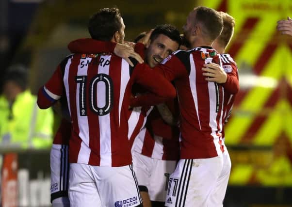 Danny Lafferty is congratulated by his team mates after scoring against Shrewsbury Town. Pic Simon Bellis/Sportimage