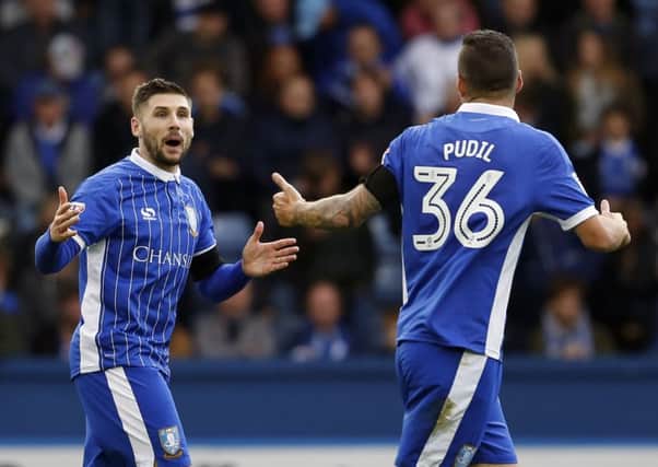 Gary Hooper shares a laugh with Daniel Pudil after putting Wednesday ahead against QPR
