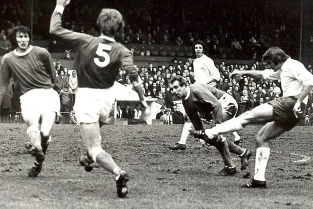England World Cup winner Roger Hunt firing goalwards during Chesterfield's visit to Bolton Wanderers on November 13th, 1971. Albert Phelan and Charlie Bell try to block, while Albert Holmes look on, anxiously.
