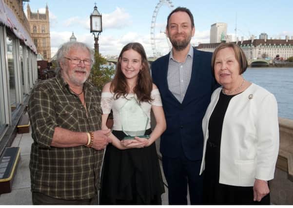 Storm Burgess receives award at House of Lords