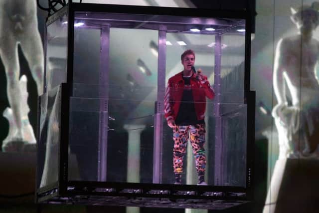 Justin Bieber arrives on stage at Sheffield Arena - in a perspex box. Picture: Glenn Ashley.