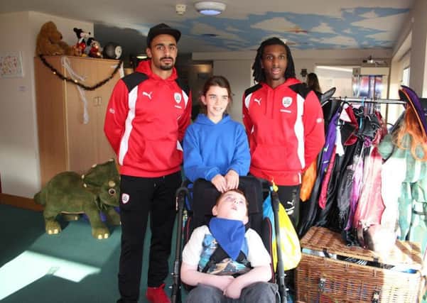 Stefan and Sessi with Bradley who also receives respite at Bluebell Wood and sister, Amber.