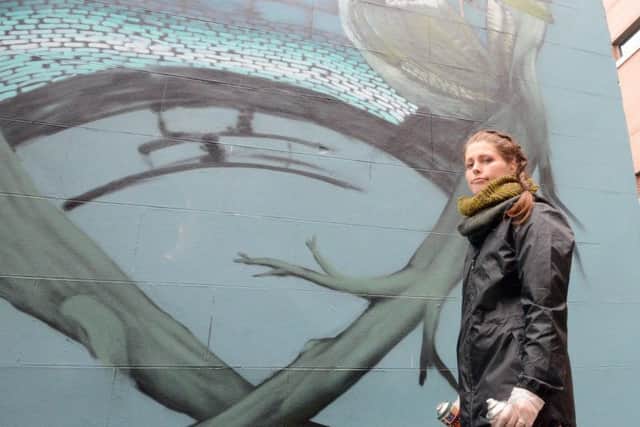 Faunagraphic re-doing the vandalised section of her new mural