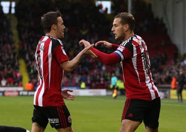 Stefan Scougall celebrates with second goal scorer Billy Sharp in the win over MK Dons