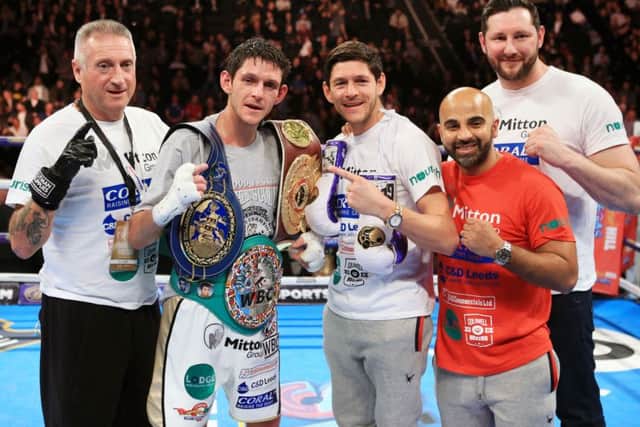 Gavin McDonnell (centre left) celebrates with brother Jamie (centre right) and trainer Dave Coldwell (second right)