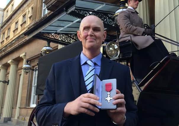 Dan Porter, Hallamn University's Head of Sport Services, received an MBE during a ceremony at Buckingham Palace.