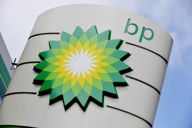 File photo of a BP petrol station, as the oil giant said profits nearly halved in the third quarter as it remained under pressure from low oil prices. Photo: Nick Ansell/PA Wire