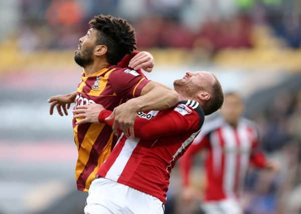 Nat Knight Percival of Bradford City throws an elbow into the face of Matt Done