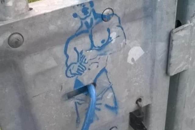 The naked man graffiti at Bentley railway station.