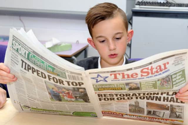 Arbourthorne Primary School pupil Alexis Mutware-Bonfils reads the Star as part of the reader passport project. Picture: Andrew Roe