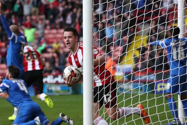 Marc McNulty celebrates scoring the last time United took on Orient at Bramall Lane in October 2014