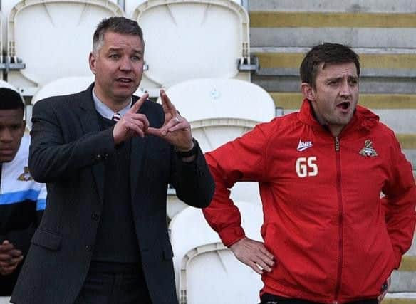 Darren Ferguson and assistant Gavin Strachan