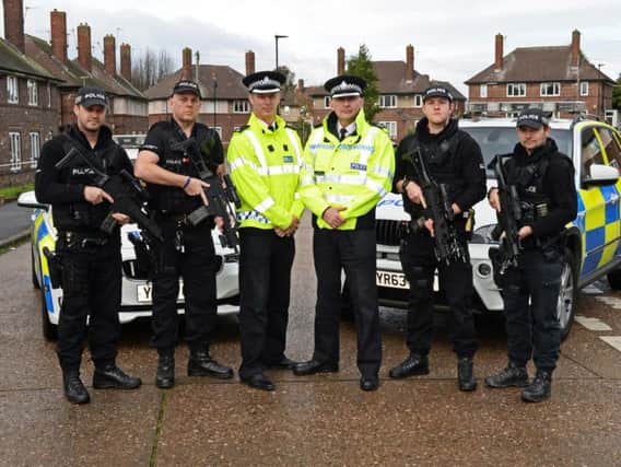 Superintendent Shaun Morley and District Commander Chief Superintendent David Hartley, with armed response officers on the Parson Cross estate