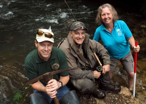 Weir removal on Peak District rivers: Weir removal on Peak District rivers: Alex Swann (left) Tim Jacklin and Julie Wozniczka by one of the breached weirs in the River Dove