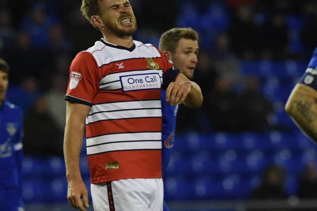 Andy Butler after suffering a heavy blow to his back at Oldham