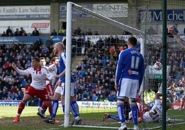 Alex Baptiste tumbles into the net after opening the scoring for Sheffield United against Chesterfield