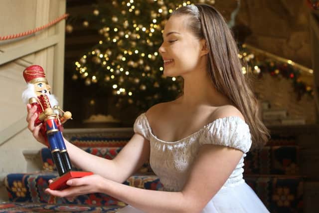 Nutcracker themed Christmas at Chatsworth House, ballerina Daisy Edwards with a nutcracker doll