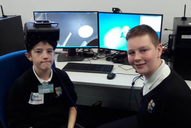 Adam Seal and Lewis Bibby from Dinnington High School try their hand at virtual reality