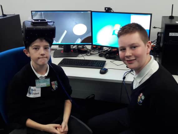 Adam Seal and Lewis Bibby from Dinnington High School try their hand at virtual reality