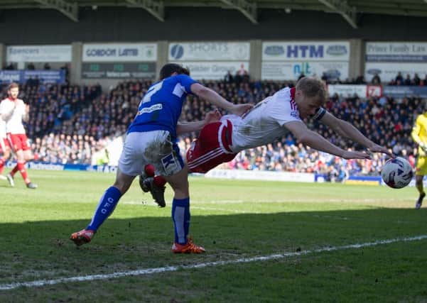Chesterfield vs Sheffield United - Connor Dimaio sends Jay McEveley flying - Pic By James Williamson