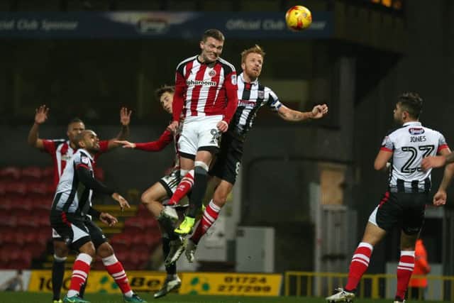 Caolan Lavery of Sheffield Utd heads over the bar during the Checkatrade Trophy match at Blundell Park Stadium, Grimsby. Picture date: November 9th, 2016. Pic Simon Bellis/Sportimage