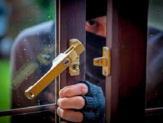 A burglar sneaked into an OAP's bedroom