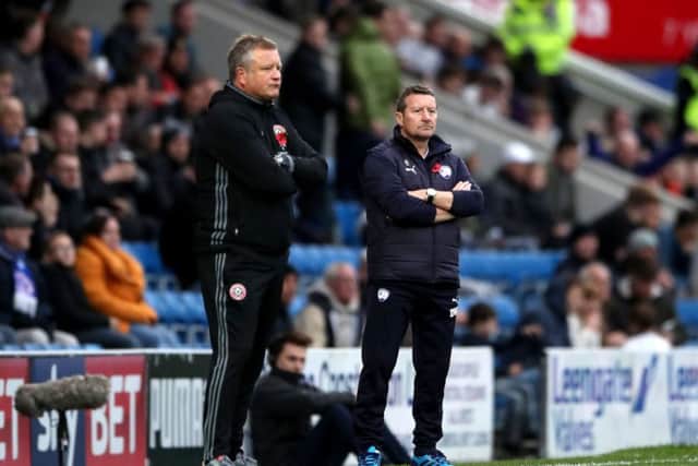 Sheffield United manager Chris Wilder (left) and Chesterfield's manager Danny Wilson (right) on the touchline during the Sky Bet League One match at the Proact Stadium, Chesterfield. PRESS ASSOCIATION Photo.