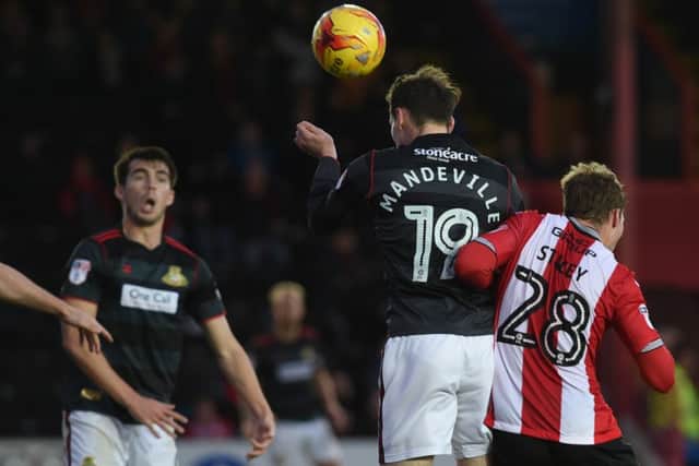 Liam Mandeville heads home Rovers' equaliser at Exeter