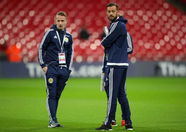 Scotland's Leigh Griffiths (left) and Steven Fletcher inspect the pitch prior to the 2018 FIFA World Cup qualifying, Group F match at Wembley Stadium, London. PRESS ASSOCIATION Photo