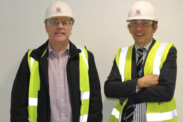 Graham Royle, left, is given  a tour of the play tower in Stheffield Children's Hospital's new wing