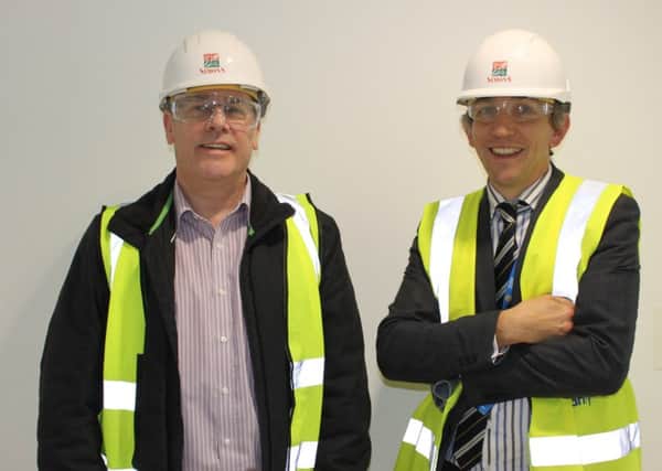 Graham Royle, left, is given  a tour of the play tower in Stheffield Children's Hospital's new wing